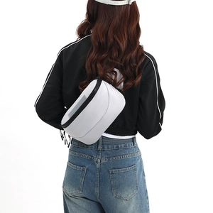 Detailed back view of white waterproof crossbody bag showing zipper and strap on model