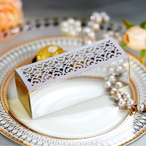 Elegant laser-cut wedding favor box in silver and gold mirror finish for chocolate candy