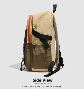 Detail view of the waterproof outdoor backpack showing mesh side pocket and buckle