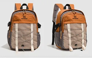Detail view showing orange and grey sports backpack with mesh pocket and elastic bungee cords