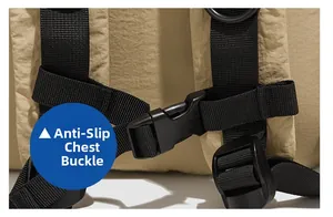 Detail view of adjustable non-slip chest buckle and strap on khaki nylon backpack