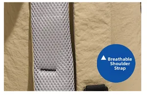 Close-up of breathable mesh shoulder straps and durable wrinkled fabric on travel backpack