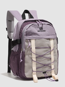 Waterproof purple nylon backpack with mesh pocket and elastic bungee system for outdoors