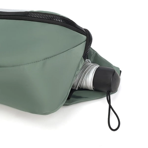 Detailed view of the waterproof crossbody bag storage holding a compact umbrella