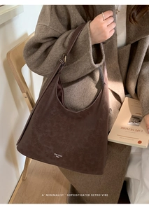 Detail view of the vintage dark brown matte underarm bag with adjustable strap