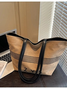 Large striped canvas tote bag with black leather straps and ZYS print for daily commuting
