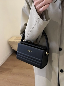 Elegant black leather handbag with magnetic clasp and golden lock for women fashion