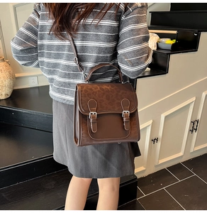 Detailed back view of a retro brown leopard print backpack with metal buckle straps