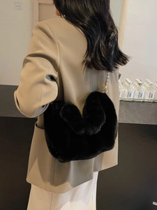Women's black faux fur shoulder bag with gold chain strap, luxury winter plush handbag