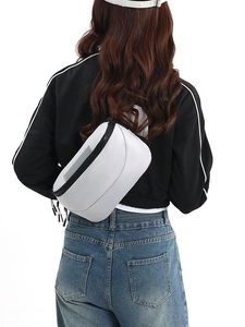 White waterproof half-moon crossbody chest bag with black zippers and adjustable strap