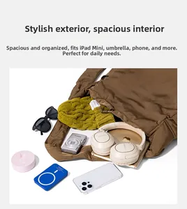 Spacious brown tote bag interior showing large capacity for tablet and daily items