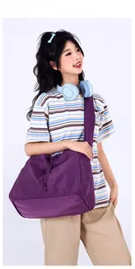Detailed view of the purple nylon tote bag featuring durable fabric and drawstring closure