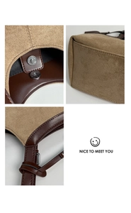 Detailed close-up of retro suede tote bag stitching and metallic magnetic buckle