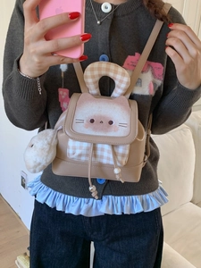 Charming beige leather cartoon cat backpack with checkered accents and plush pendant