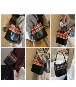 Detail view showing grid layout of plaid patchwork bucket bag in red and black options