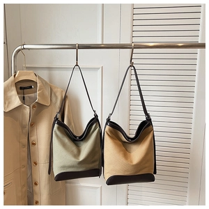 Retro canvas bucket bag with leather handles in sage green and khaki, vintage tote style
