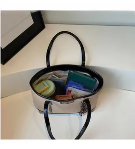 Top-down view of large canvas tote bag interior showing spacious multi-item storage capacity