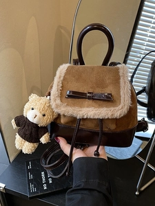 Brown suede backpack with plush trim, bow detail and teddy bear charm for women
