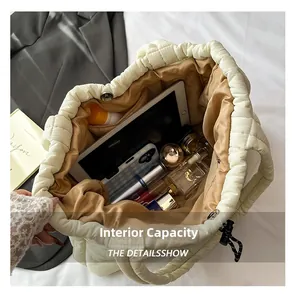 Detailed interior view of quilted puffer tote bag showing spacious storage for essentials