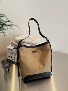 Stylish khaki canvas bucket bag with brown leather trim for women daily commuting