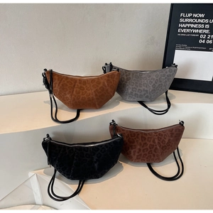 Detailed display of four leopard print croissant bags in various autumn colors