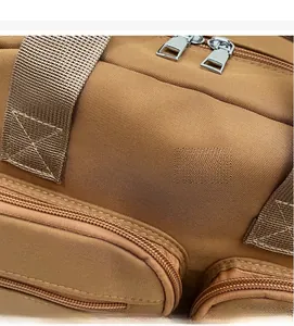 Close-up of high-density brown canvas fabric and reinforced stitching on a shoulder bag