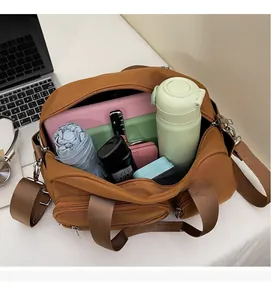 Brown nylon tote bag interior showing large capacity for laptop and daily essentials