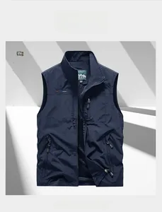 Detailed view of dark blue outdoor vest showing zipper pockets and breathable mesh lining