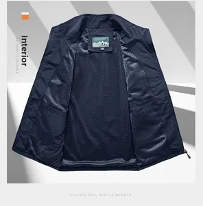 Detail of dark blue outdoor vest showing breathable mesh lining and inner pockets