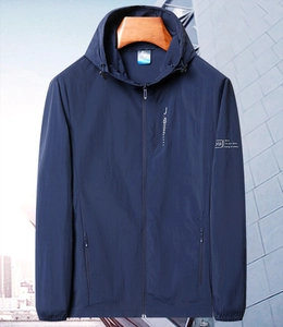 Detail of navy blue sun protection jacket with drawstring hood and zipper pockets