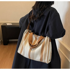 Rear view of striped canvas tote bag showing large capacity and thick shoulder straps