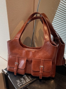 Retro brown faux leather tote bag with dual front buckle pockets and zipper closure