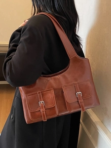 Retro brown faux leather tote bag with dual front pockets and silver buckle accents