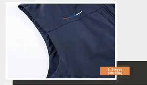 Detailed macro view of the reinforced stitching on navy blue outdoor vest armhole