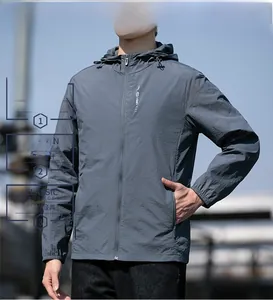 Close-up of lightweight matte windproof jacket with adjustable hood and zip pocket