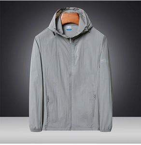 Detail of grey lightweight sun protection jacket with hood and functional zip pockets
