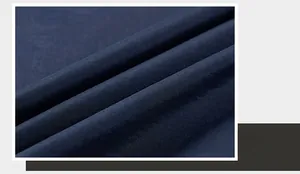 Detailed macro view of dark blue twill fabric texture for casual outdoor vest