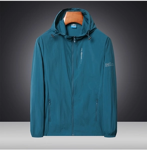 Detail of hooded sun protection jacket in light blue ice silk with zipper pocket