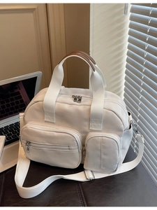 Large capacity cream canvas tote bag with brown leather trim and adjustable shoulder strap