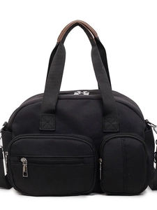 Black canvas tote bag with multi-pocket design and brown leather handle reinforcement