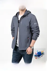 Detail of lightweight gray sun-protective jacket with drawstring hood and zipper closure
