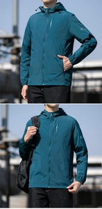 Detailed view of peacock blue hooded windbreaker with lightweight sun protection fabric