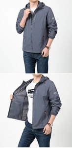 Detailed view of gray hooded sun protection jacket with adjustable drawstring and zip pockets