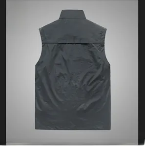 Rear view of deep gray outdoor cargo vest with high collar and reinforced stitching