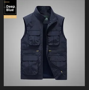 Detail view of deep blue multi-pocket utility vest with zip closure and cargo pockets