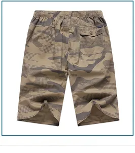 Detail of cargo shorts showing camo pattern texture, elastic waist, and back button pocket
