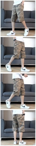 Detail view of men's camouflage cargo shorts with zipper pockets and drawstring waist