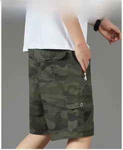 Detail of cargo shorts featuring camouflage pattern, side flap pocket and zipper closure