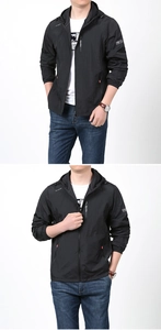 Detail of men's black hooded sun protection jacket with zip pockets and elastic cuffs