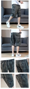 Detail showing elastic drawstring waist and large zipper pockets on camo cargo shorts